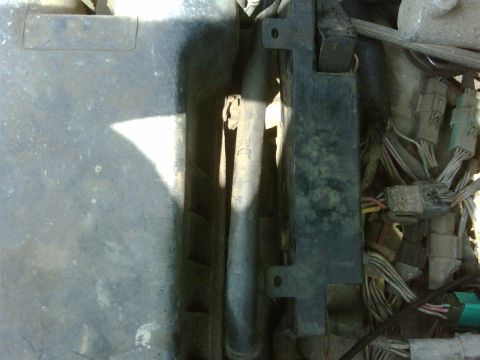 1990 Ford Bronco - Close-up view of engine bay components, including wiring and hoses.