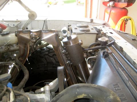 1996 Ford Bronco - Custom front suspension components are visible in the engine bay, alongside a large tire.