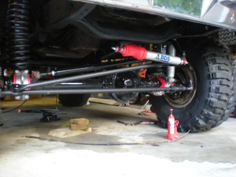 1978 Ford Bronco - Close-up view of a lifted vehicle's suspension system, a BDS shock absorber and heavy-duty components.