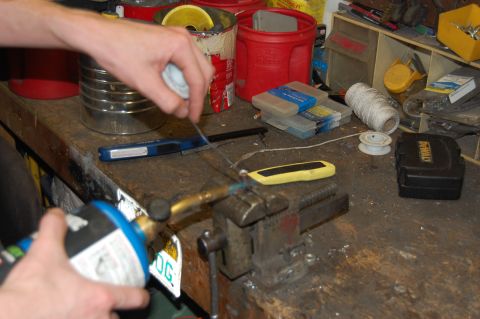 1994 Ford Bronco - Filling the copper lug with flux core solder.