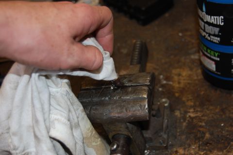 1994 Ford Bronco - Dabbing the excess flux out with a drill bit wrapped in a rag.