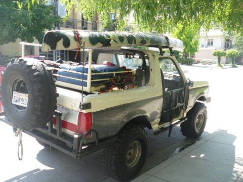 1991 Ford Bronco - This modified Ford Bronco is equipped for an outdoor adventure with a canoe and camping gear.