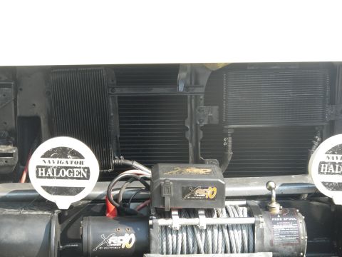 1991 Ford Bronco - This vehicle is equipped with a winch and auxiliary lighting, suggesting off-road use.