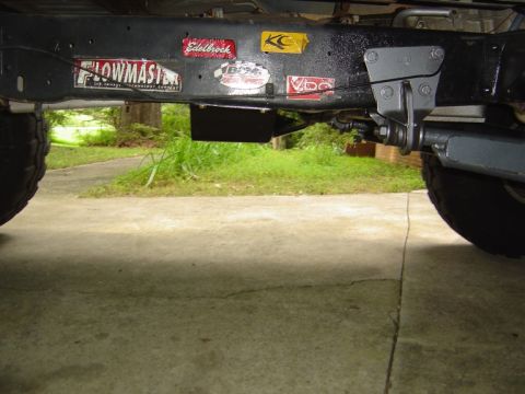 1986 Ford Bronco - Underside view of a vehicle frame adorned with various performance part stickers.