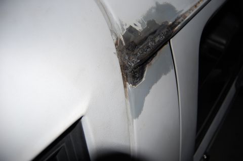 1994 Ford Bronco - Detail of a welded seam on a vehicle's body panel, indicating repair or modification.
