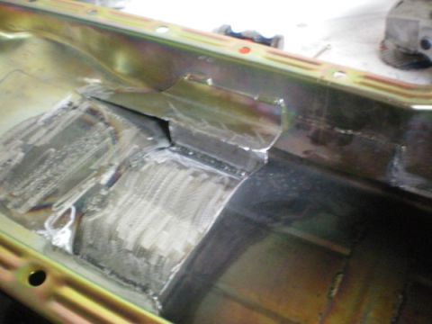 1969 Ford Fairlane - This is a close-up view of a welded oil pan, showing repairs and metal work.