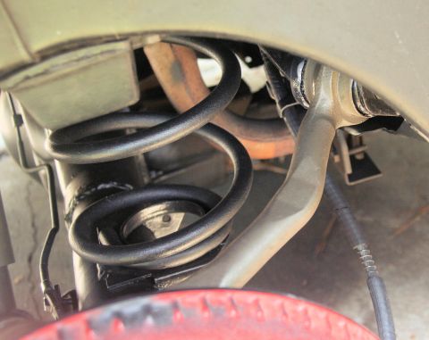 1976 Ford Ranchero - Rear suspension components, including a coil spring and control arm, are shown in detail.