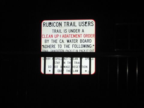 1989 Ford Bronco - A sign details a clean up and abatement order for Rubicon Trail users, outlining rules for sanitation and environmental protection.