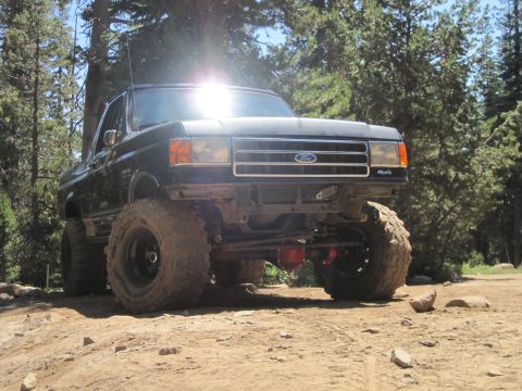 1989 Ford Bronco - This lifted black Ford Bronco is equipped for off-road adventures on a sunny day.
