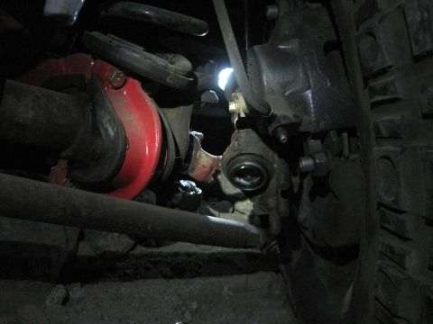 1989 Ford Bronco - Close-up view of a vehicle's suspension and braking system components.