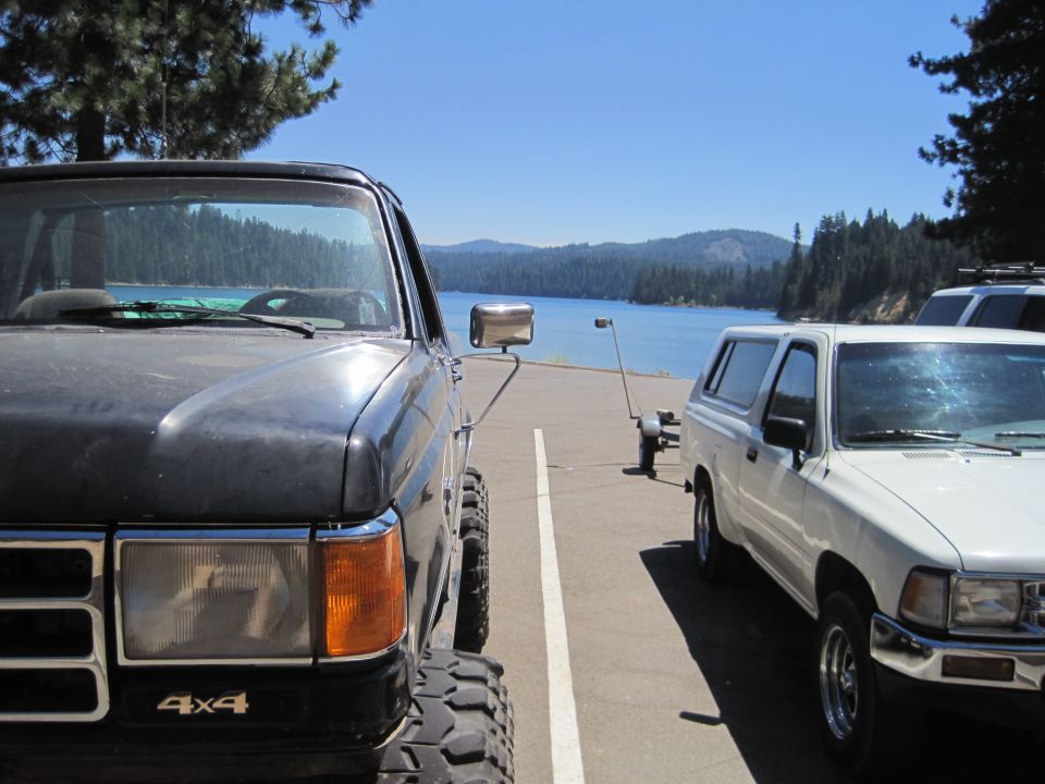 Front view of a dark 1987 Ford F-Series pickup truck with "4x4" badge