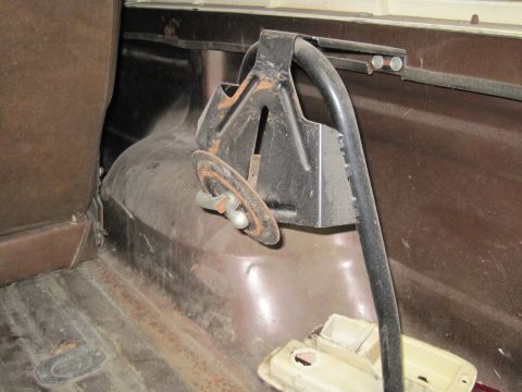 1979 Ford Bronco - The interior of the vehicle shows the spare tire mount and the floor of the cargo area.