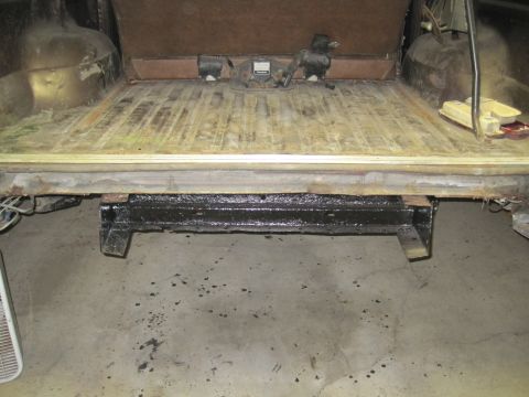 1979 Ford Bronco - The rear cargo area of a vehicle, showing the floor and an installed trailer hitch.