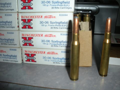 1996 Ford Bronco - Several boxes of Winchester 30-06 Springfield ammunition are stacked, with three cartridges displayed prominently.