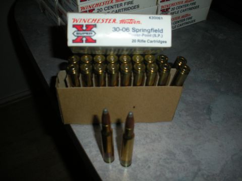 1996 Ford Bronco - A box of Winchester 30-06 Springfield rifle cartridges is shown with two loose rounds in the foreground.