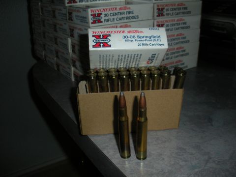 1996 Ford Bronco - Several boxes of Winchester Super X 30-06 Springfield cartridges are stacked, with loose cartridges in a box in the foreground.