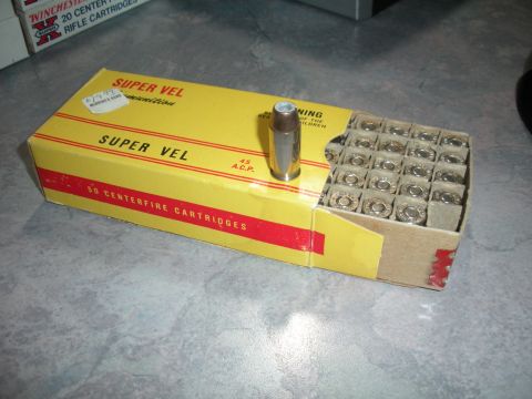 1996 Ford Bronco - A box of 45 ACP ammunition is shown with one cartridge removed from the packaging.
