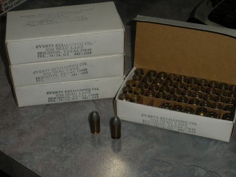 1996 Ford Bronco - Boxes of ammunition from Everts Reloading Co. are shown, with one box open and two cartridges on the side.