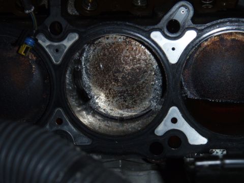 2006 Dodge Charger - Engine cylinder damage visible on piston and cylinder wall.