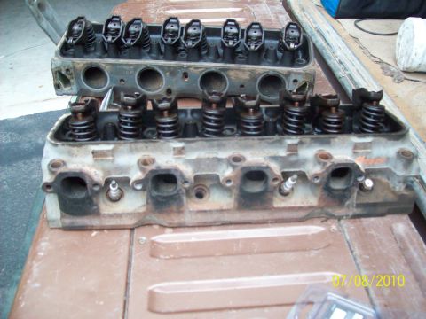 1985 Ford Bronco - Two engine cylinder heads are shown, likely removed for repair or rebuilding.