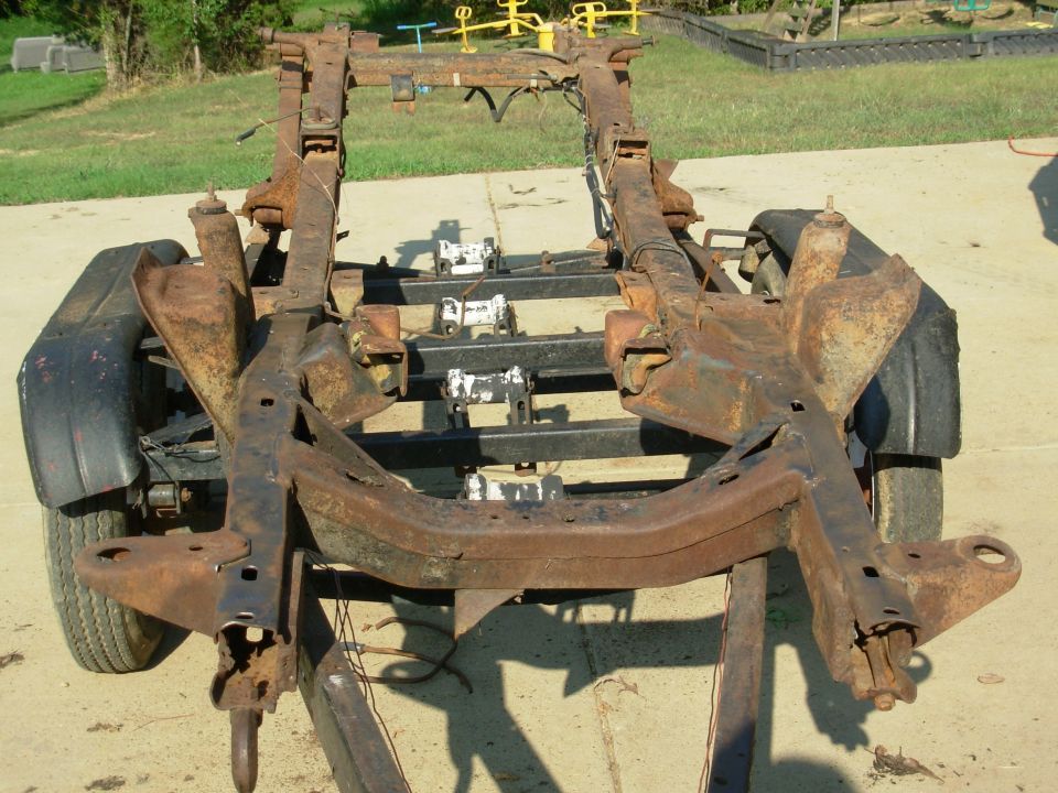 Bare truck chassis frame on driveway from the front