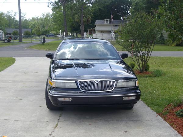 Front view of a black 1995 Mercury Grand Marquis parked on a driveway