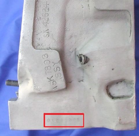 1973 Ford Mustang - Close-up of a metal part showing various stamped casting and identification numbers.