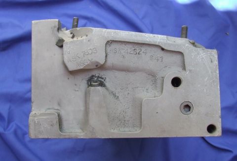 1973 Ford Mustang - A metal casting with part numbers and assembly information is shown against a blue cloth background.