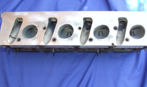 1973 Ford Mustang - Close-up view of an engine cylinder head, showing intake and exhaust ports.
