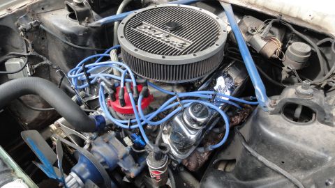 1964 Ford Fairlane - Close-up view of a V8 engine bay, aftermarket performance parts.