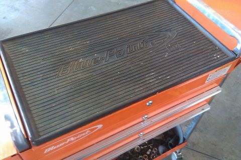 2000 Mercury Grand Marquis - An orange tool cart with a "Blue-Point" logo on its ribbed mat top and side.
