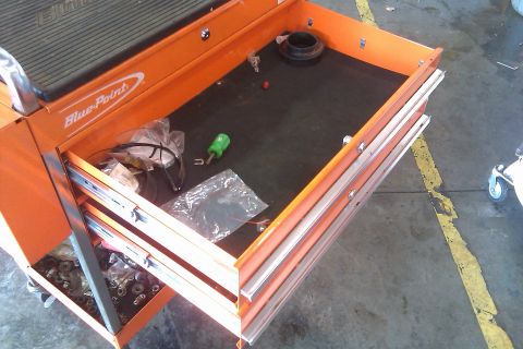 2000 Mercury Grand Marquis - Open drawers of an orange Blue-Point tool cart reveal various tools and hardware inside.