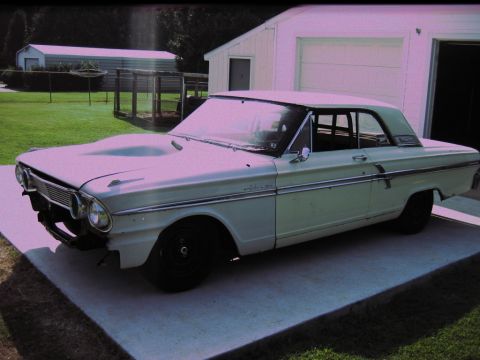 1992 Ford Mustang - This 1964 Ford Fairlane is seen in a 3/4 front view, a prominent hood scoop.