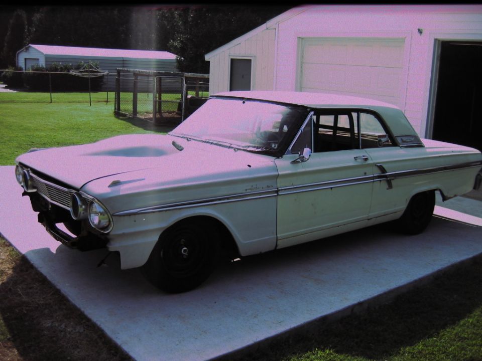 White 1964 Ford Fairlane 3/4 front view with hood scoop