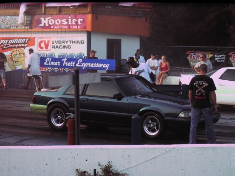 1992 Ford Mustang - 1992 Ford Mustang parked at the drag strip, with spectators in the background.