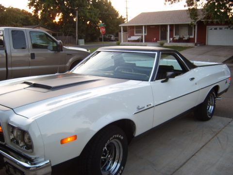 1973 Ford Ranchero - White 1973 Ford Ranchero with black hood accent and chrome wheels.