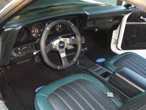 1973 Ford Ranchero - The interior of a 1973 Ford Ranchero shows its dashboard, steering wheel, and seats.