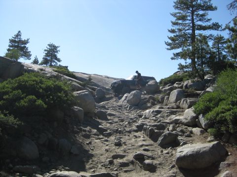 1986 Ford Bronco - 1986 Ford Bronco tackles a challenging rocky path on an off-road adventure.
