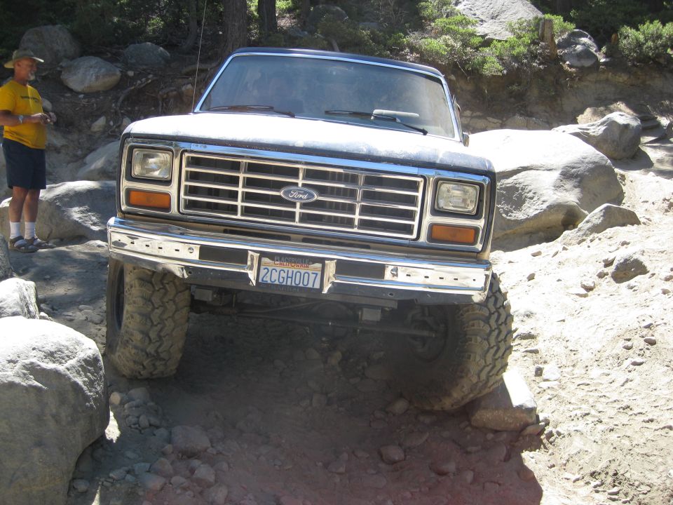 1986 Ford Bronco front view on rocky trail. California license plate 2CGH007