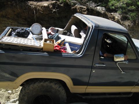 1986 Ford Bronco - This 1986 Ford Bronco, seen from the side, is packed with camping equipment and ready for an adventure.