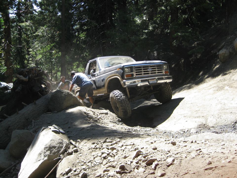 1986 Ford Bronco navigating rocky terrain