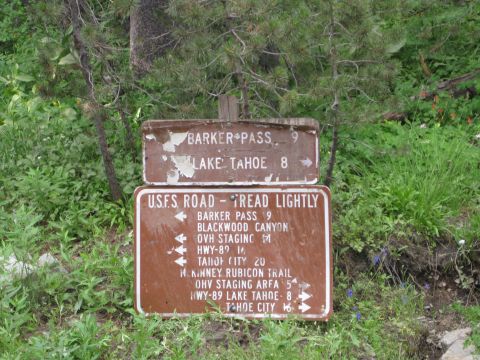 1986 Ford Bronco - Trail signs indicate directions to Barker Pass, Lake Tahoe, and various Rubicon Trail points.