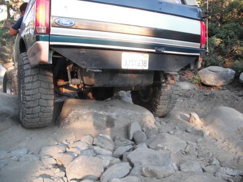 1991 Ford Bronco - The rear of a 1991 Ford Bronco navigates a challenging rocky trail.
