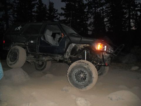 1991 Ford Bronco - This modified 1991 Ford Bronco navigates challenging terrain during an off-road excursion.
