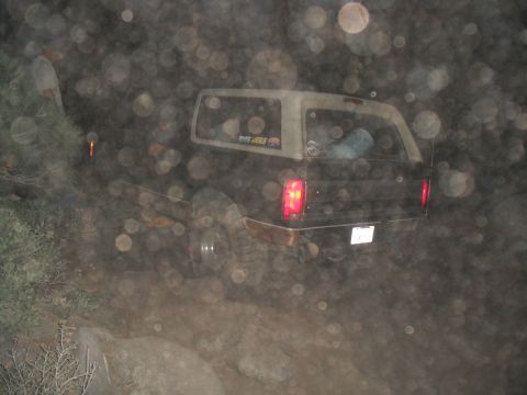 1991 Ford Bronco - This 1991 Ford Bronco is navigating a rocky, off-road trail in the dark.