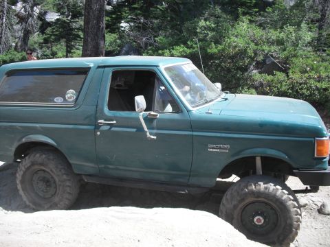 1991 Ford Bronco - This 1991 Ford Bronco is shown off-road with large tires and a lifted suspension.