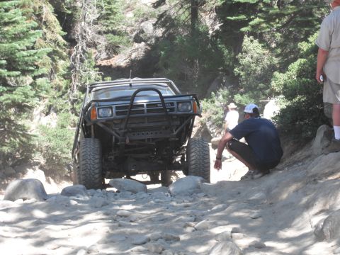 1991 Ford Bronco - Modified Toyota 4Runner tackles a challenging rocky path during an off-road excursion.