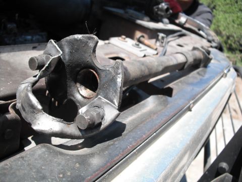 1991 Ford Bronco - This damaged steering linkage part appears to be from a vehicle undergoing repair or modification.