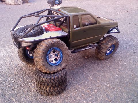 1996 Ford Bronco - This RC truck has a custom roll cage and spare tire mounted on the bed.