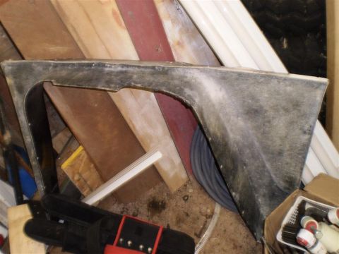 1978 Ford Bronco - A dark gray fender flare is shown, likely a replacement part for a vehicle.